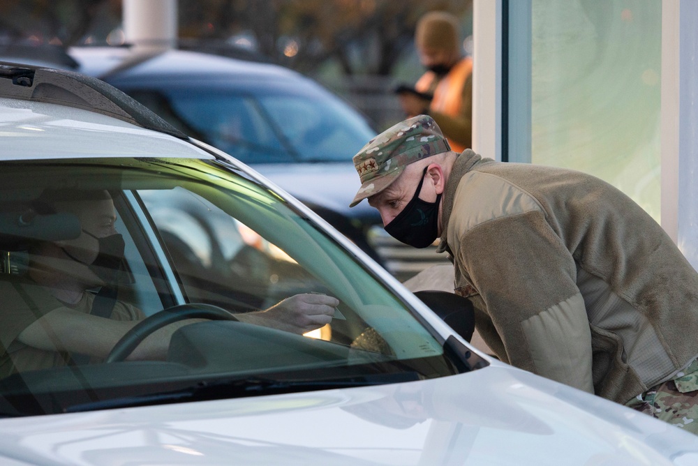 Gen. Bunch Checks ID Cards at Wright-Patt Gate