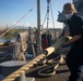 USS Sioux City Sailor Takes in a Line During Sea and Anchor Detail