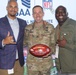 Fort Carson garrison commander receives game ball from Broncos alumni