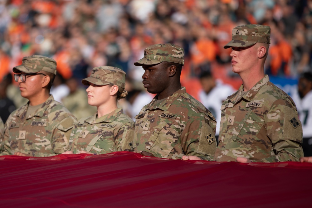 4ID Soldiers unfurl U.S. flag during Broncos game
