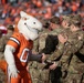 Miles the mascot high-fives 4ID and Fort Carson Soldiers