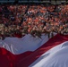 Fort Carson Soldiers hold flag at Broncos game