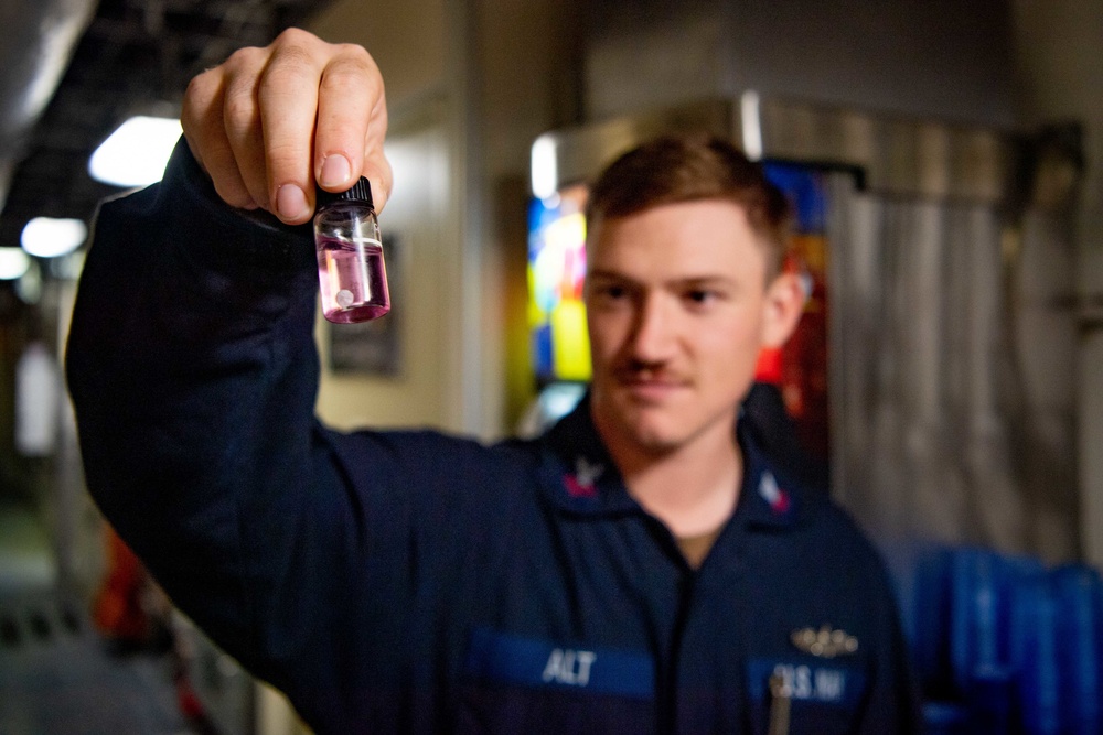 USS Charleston Conducts Water Sample Test