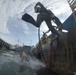 MDSU 2 Sailor Executes a Front Step Water Entry During Underwater Site Survey