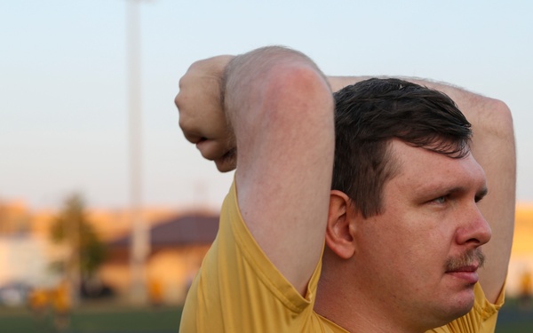 Electricians Technician (Nuclear) 2nd Class Brody Bothe warms up in preparation for the Navy Physical Readiness Test (PRT) the aircraft carrier USS George Washington (CVN 73) is conducting at Huntington Hall.