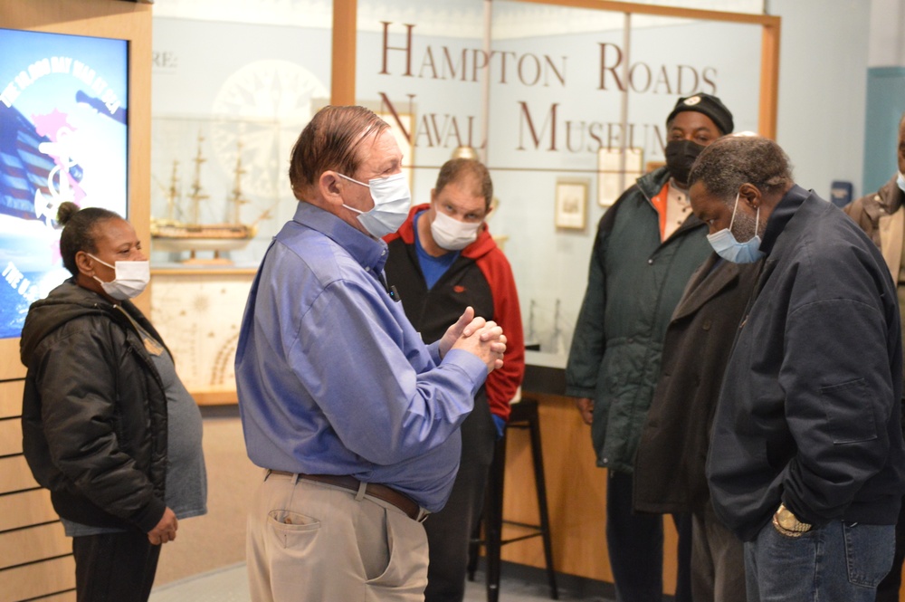 Museum volunteer leads guided tour