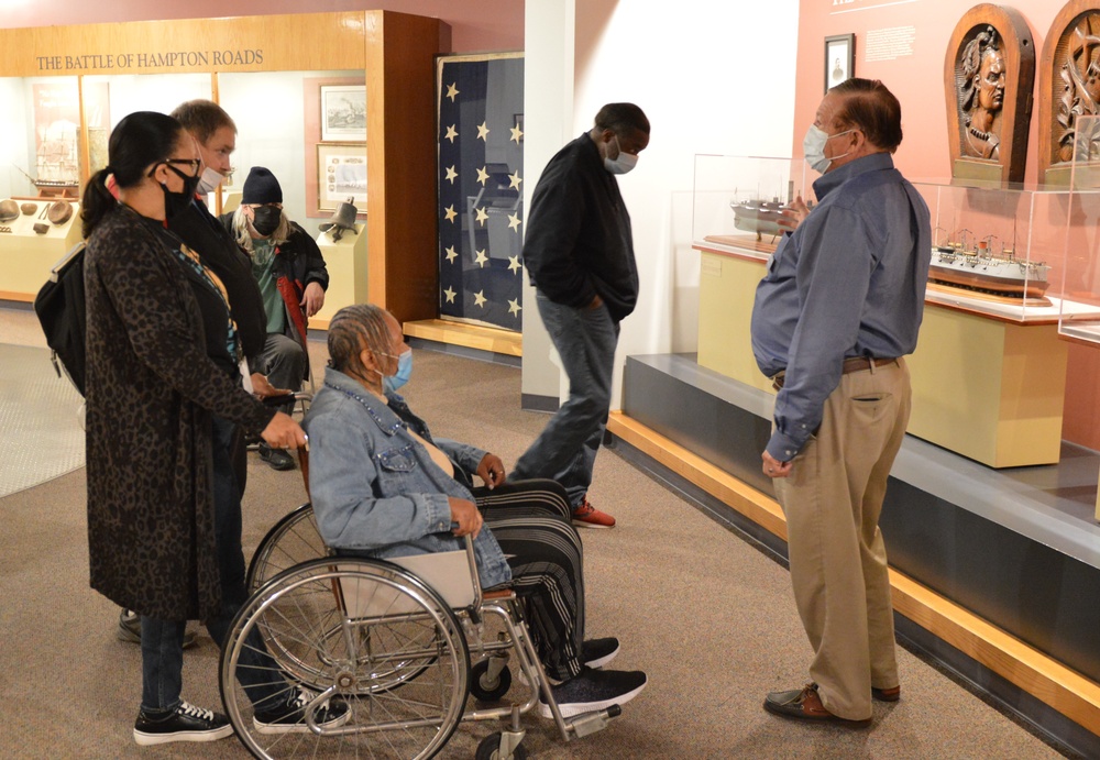 Museum volunteer leads guided tour