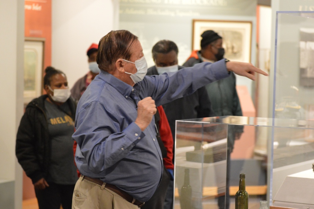 Museum volunteer leads guided tour