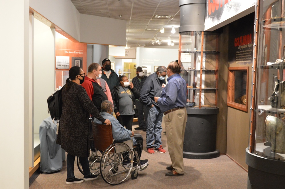 Museum volunteer leads guided tour