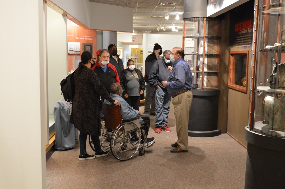 Museum volunteer leads guided tour