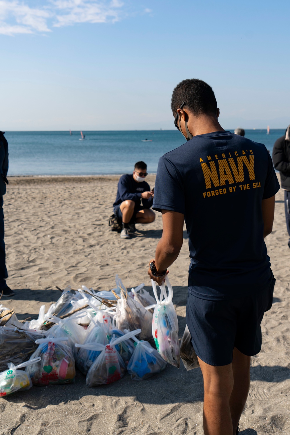 CFAY Sailors pick up trash at the annual Zushi Beach clean-up