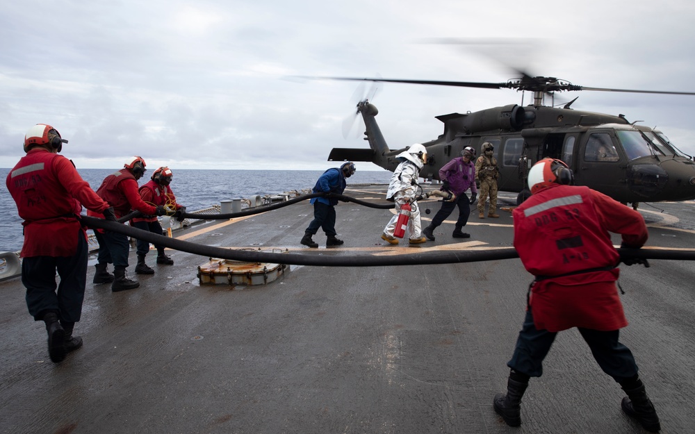 US Army UH-60 Blackhawks perform deck landing qualifications aboard USS John Paul Jones