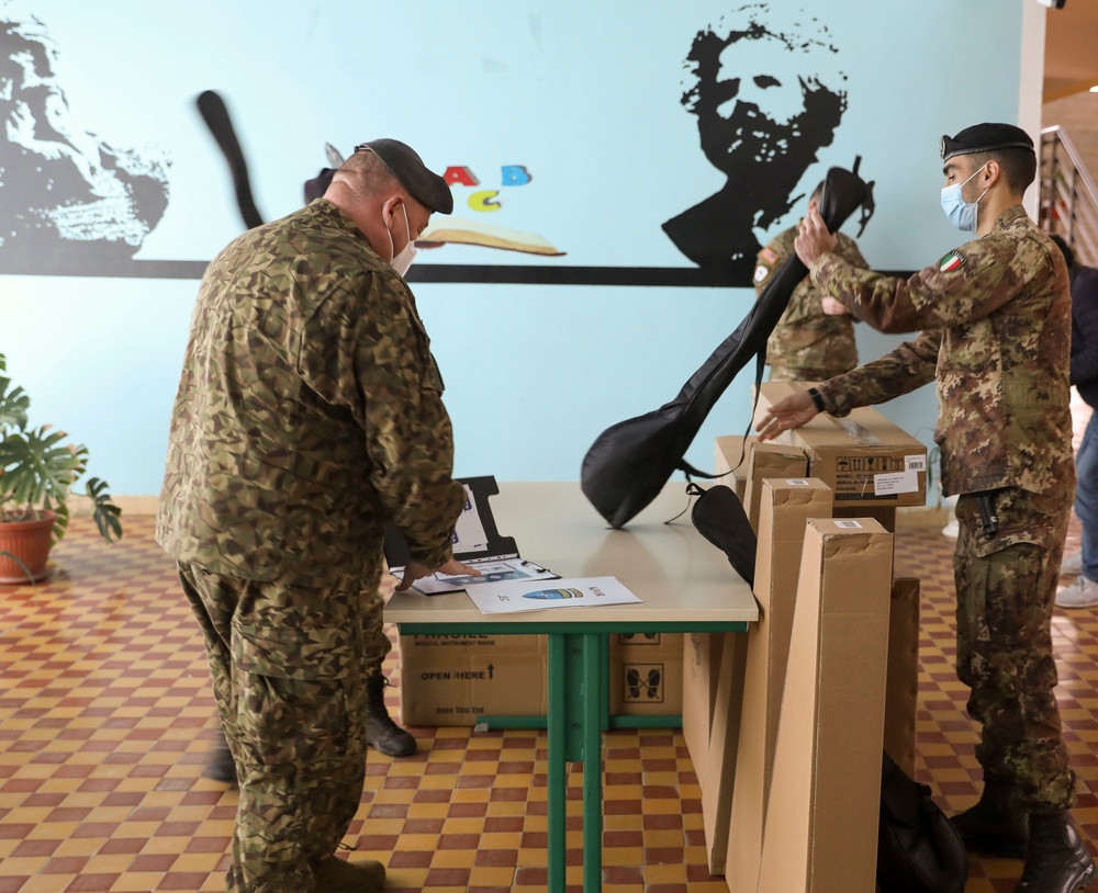 KFOR Soldiers deliver donated musical instruments to the Zenel Hajdini School in Trstenik (Glogovac)