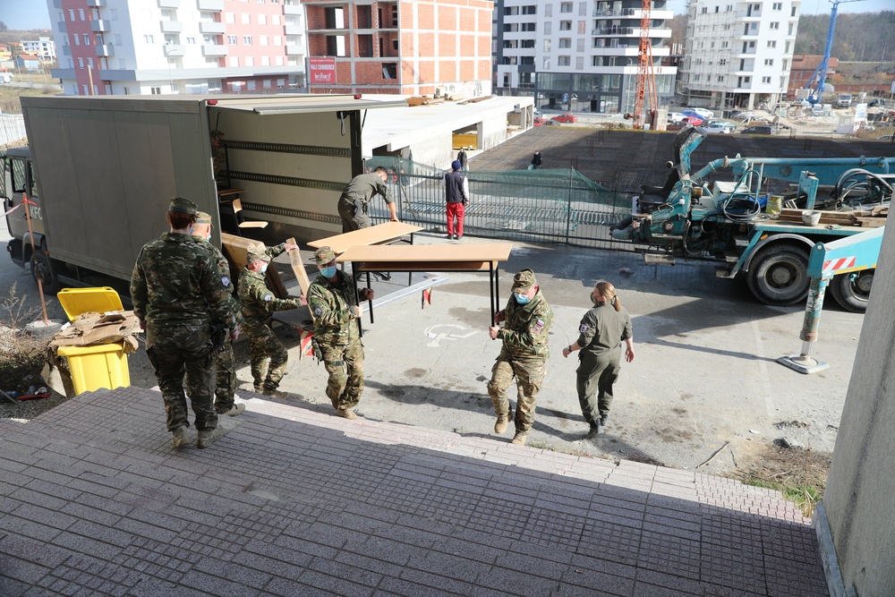KFOR Soldiers deliver computer and office equipment to the Public Youth Center of Skenderaj