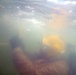 MDSU 2 Sailor Grabs a Line to Tie a Hose After Dredging Ops