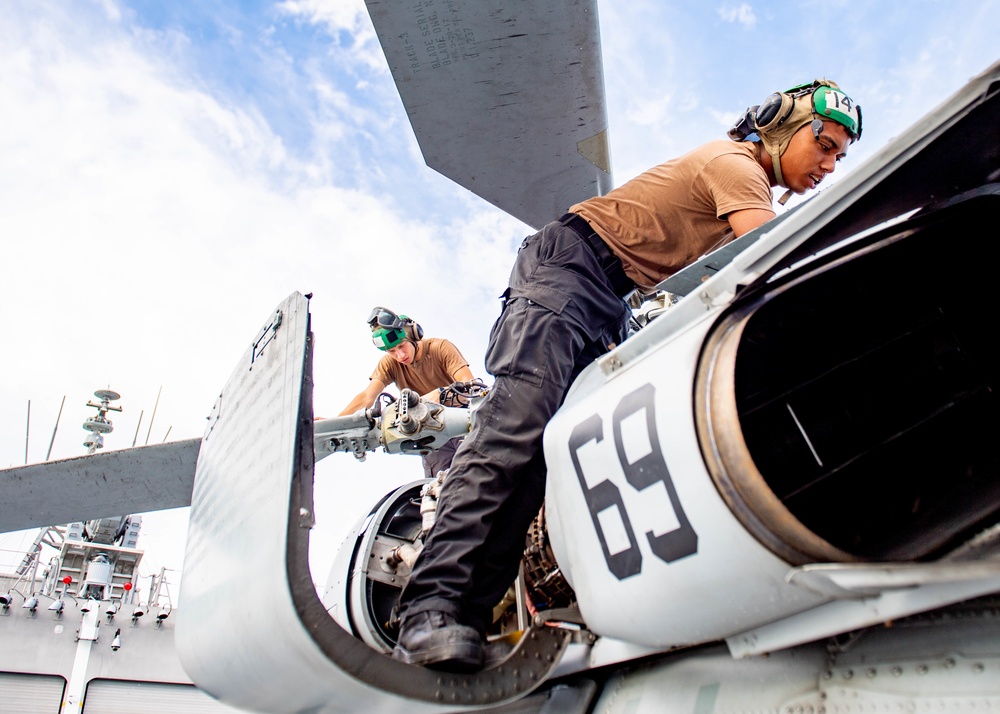 USS Charleston Sailors Conduct Maintenance on MH-60S Sea Hawk
