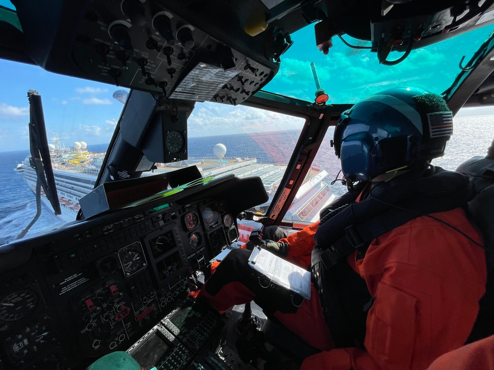 Coast Guard Air Station New Orleans MH-65 helicopter crew arrive on-scene to medevac a woman from the Carnival Glory approximately 72 miles south of Southwest Pass, Louisiana on Nov. 20, 2021. (U.S. Coast Guard by Air Station New Orleans)