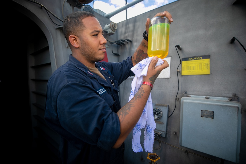 USS Sioux City Sailor Checks Quality of a Fuel Sample