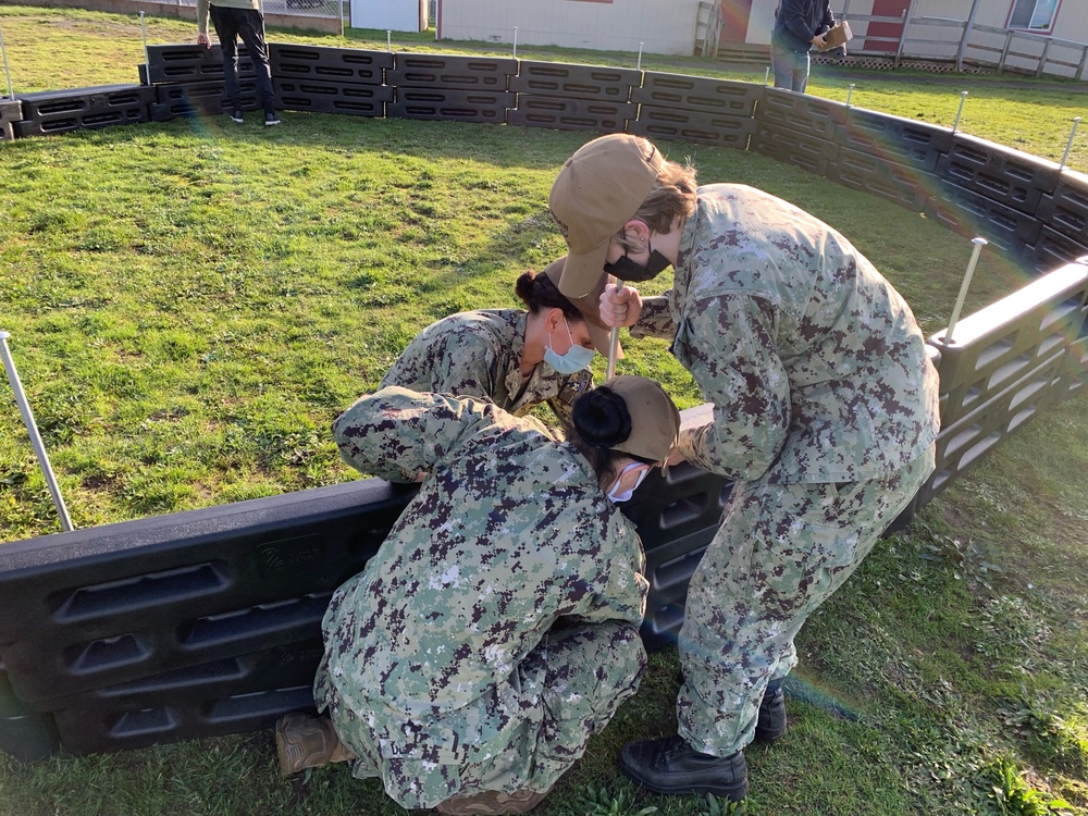 Sailors Build Playground Equipment