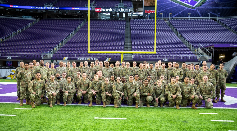 TF McCoy Soldiers Present Flag At NFL Game
