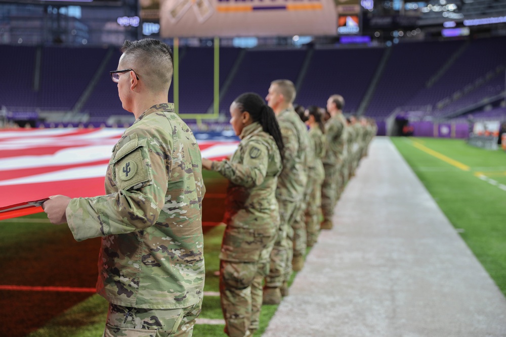 Military Members Participate in Salute to Service Football Game