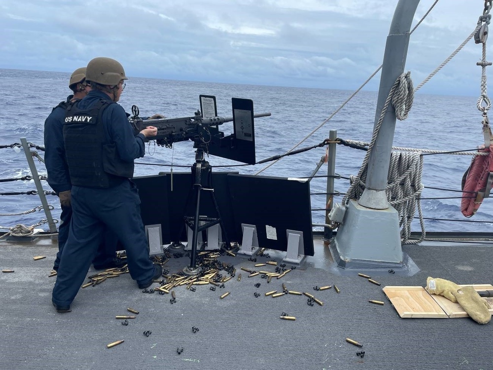 Sailors aboard USS Stockdale perform live fire exercise
