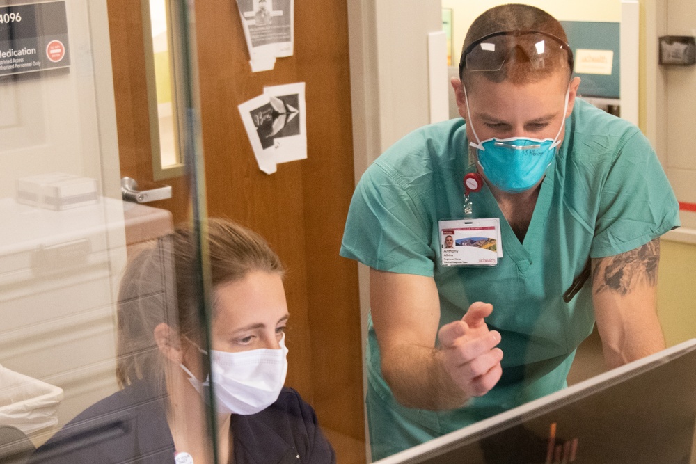 Department of Defense Airmen integrate into Colorado hospital's day-to-day operations