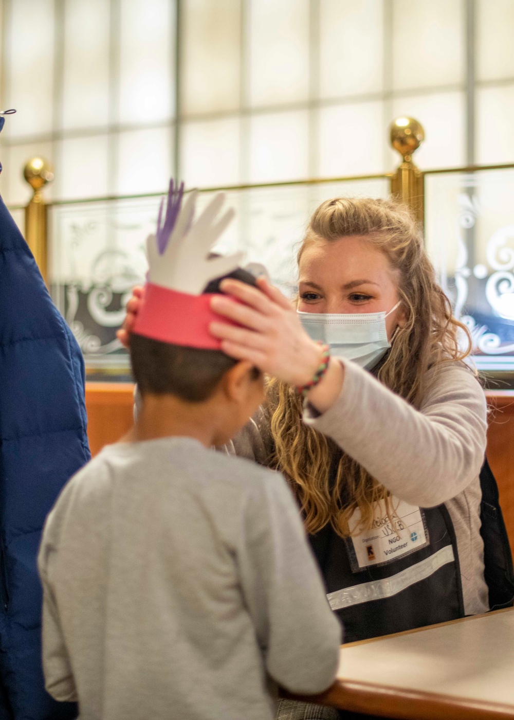 USCCB makes Thanksgiving Day turkey headbands for Afghan guests
