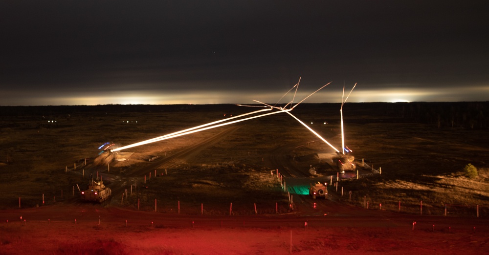 Soldiers with 3rd Battalion, 66th Armored Regiment, 1st Armored Brigade Combat Team, 1st Infantry Division conduct night live-fire