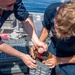 USS Charleston Sailors Transport MK 110 57mm Ammunition