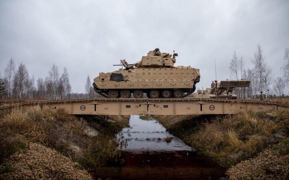 1st Infantry Division Soldiers operate the Joint Assault Bridge Vehicle during Winter Shield 2021