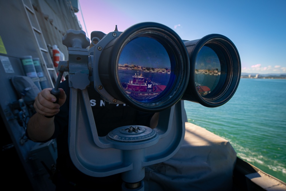 USS Sioux City Sailor Looks Through the Ship’s Binoculars