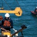 Crew members of the Coast Guard Cutter Aspen conduct small boat hoisting evolutions