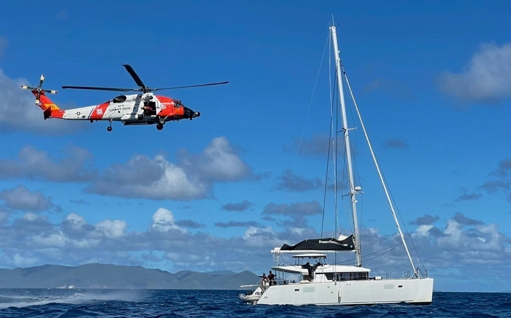 Coast Guard crews combine efforts to medevac man with head injury from a sailing vessel near St. Thomas, U.S. Virgin Islands