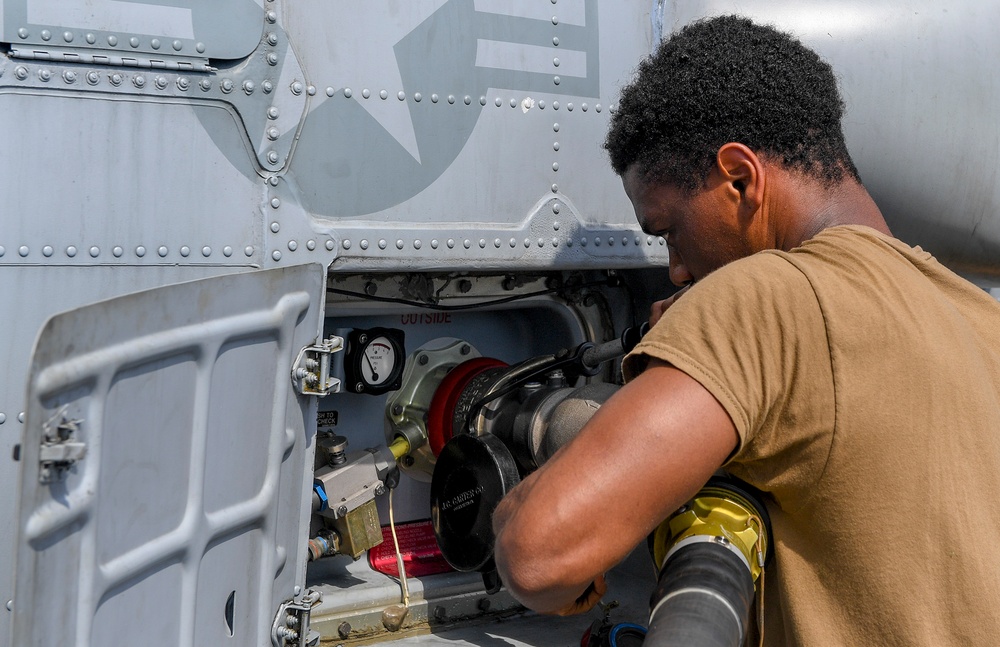 USS Chafee (DDG 90) Conducts Maintenance On A MH-60R Sea Hawk