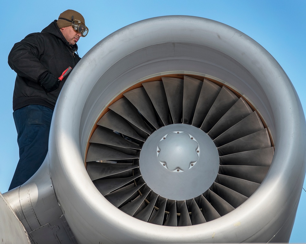 Selfridge Airman checks engine during a post flight check