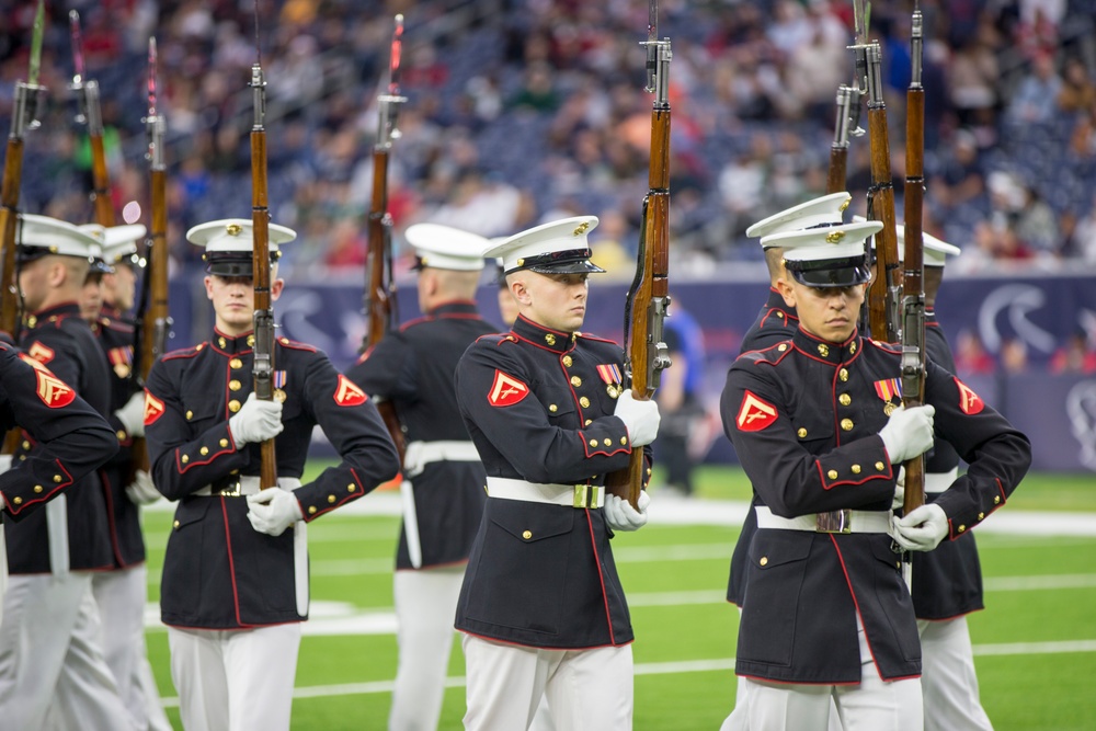 Marines with the Silent Drill Platoon perform during a halftime show at NRG Stadium in Houston, Texas