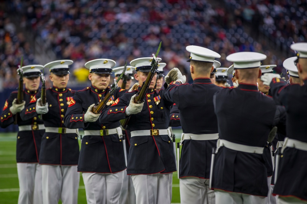 Marines with the Silent Drill Platoon perform during a halftime show at NRG Stadium in Houston, Texas
