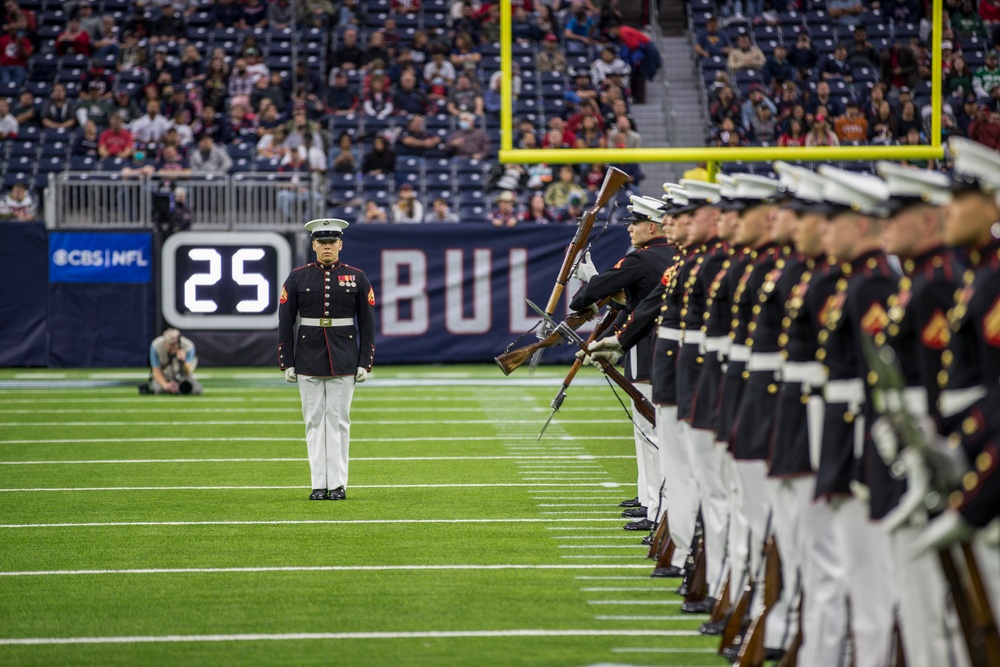Marines with the Silent Drill Platoon perform during a halftime show at NRG Stadium in Houston, Texas