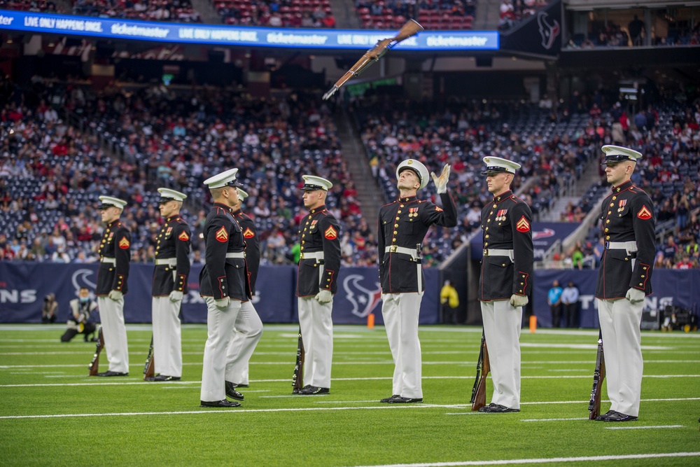 Marines with the Silent Drill Platoon perform during a halftime show at NRG Stadium in Houston, Texas