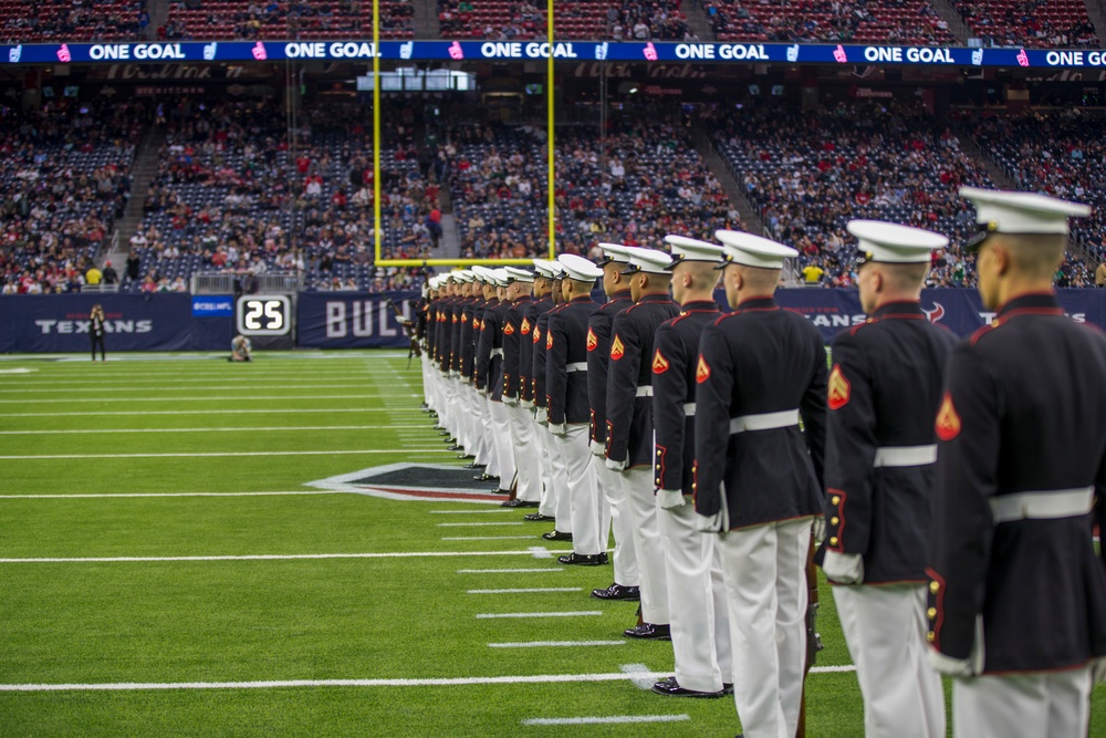 Marines with the Silent Drill Platoon perform during a halftime show at NRG Stadium in Houston, Texas