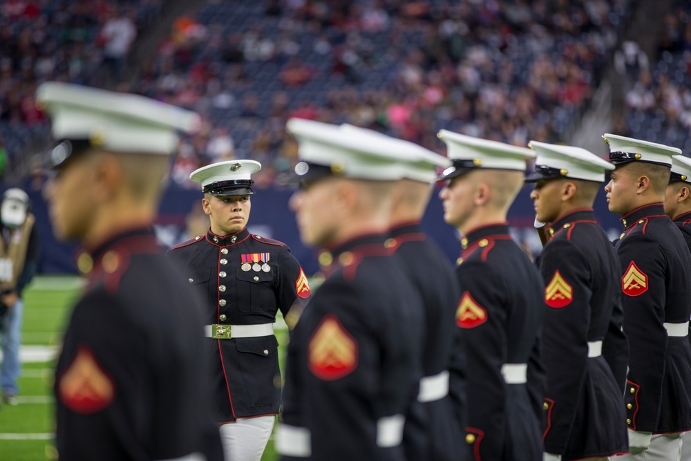 Marines with the Silent Drill Platoon perform during a halftime show at NRG Stadium in Houston, Texas