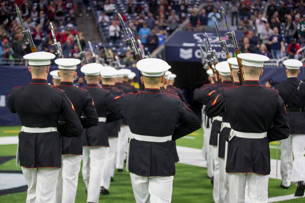Marines with the Silent Drill Platoon perform during a halftime show at NRG Stadium in Houston, Texas