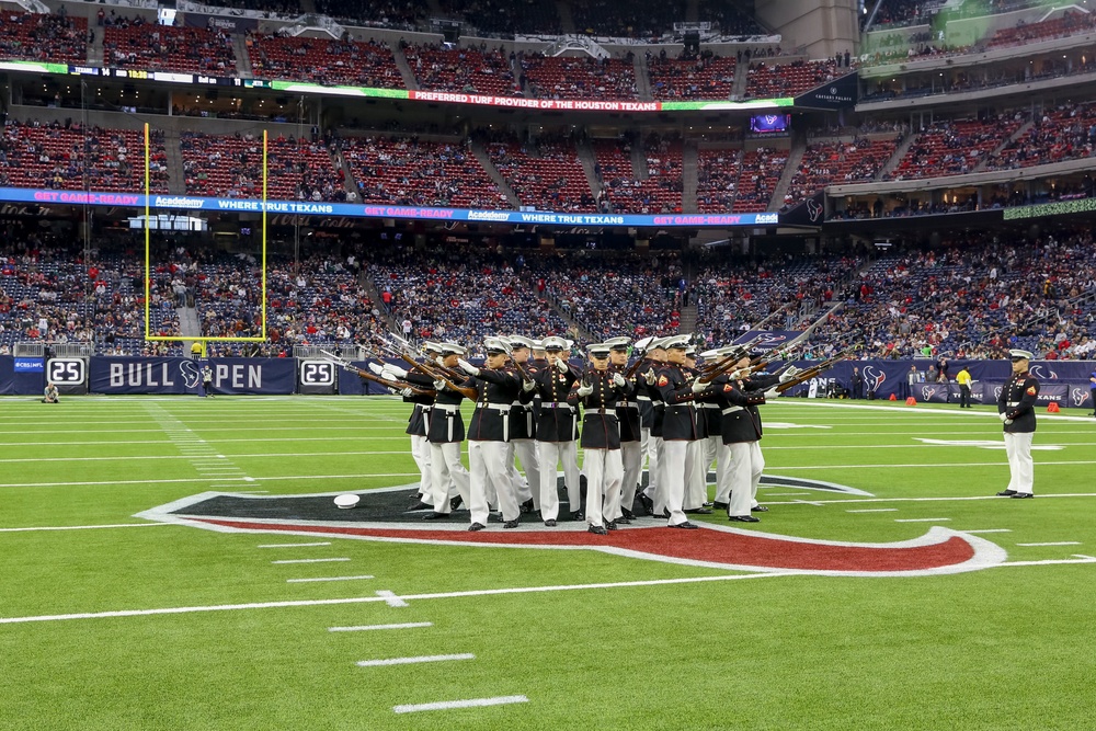Marines with the Silent Drill Platoon perform during a halftime show at NRG Stadium in Houston, Texas