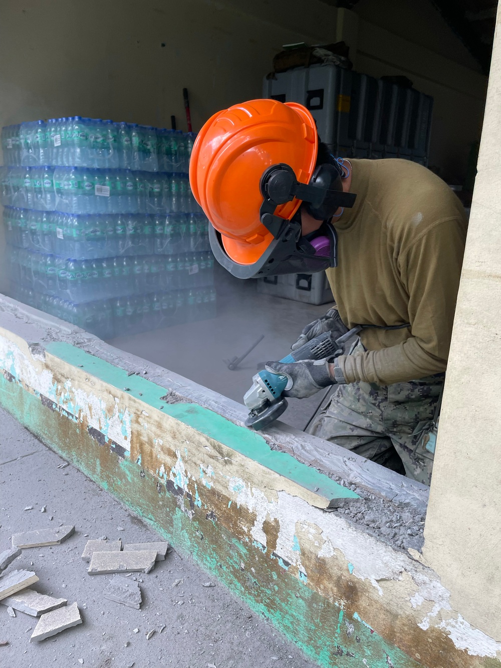 US Navy Seabees with NMCB-5 build a schoolhouse with the Armed Forces of the Philippines