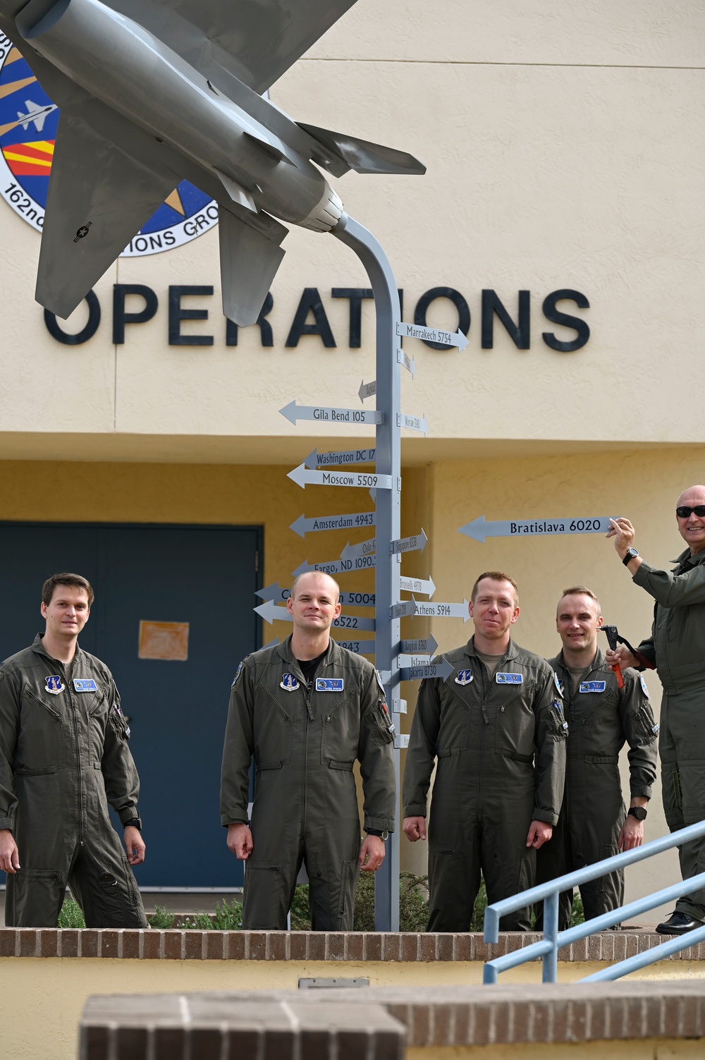 Student Pilots Add Mileage Marker to Wing Flagpole