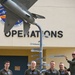 Student Pilots Add Mileage Marker to Wing Flagpole