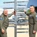 Student Pilots Add Mileage Marker to Wing Flagpole
