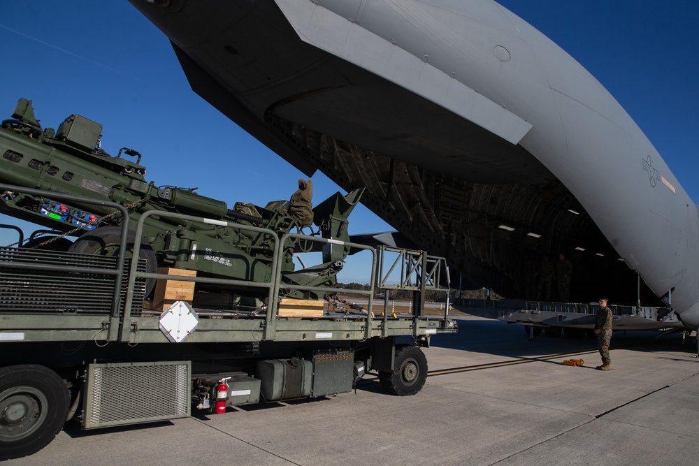 Marines and Airmen Load C-17