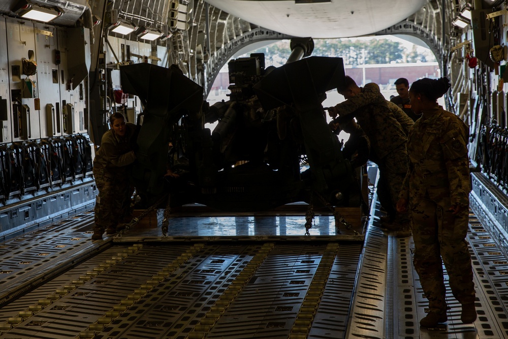 Marines and Airmen Load C-17